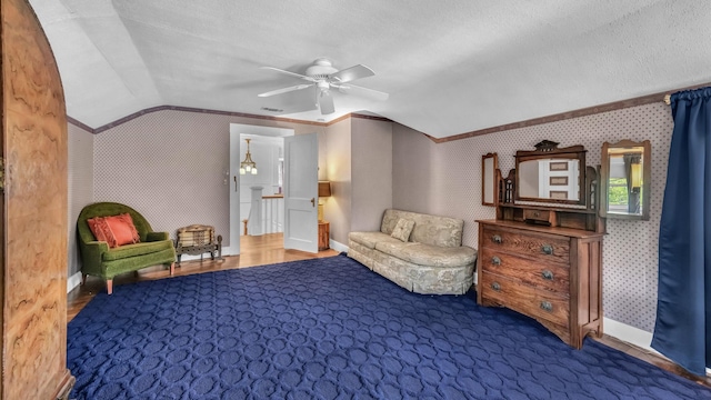305 E Lee Ave, Weatherford, TX 76086 - sitting room with vaulted ceiling, a ceiling fan, a textured ceiling, ornamental molding, and wallpapered walls