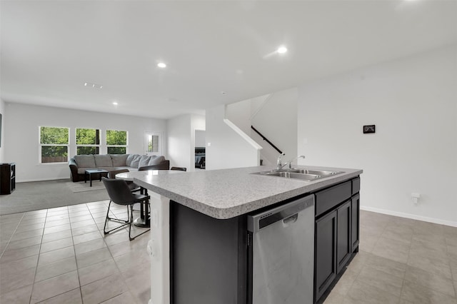 16721 Porterfield Ln, Justin, TX 76247 - kitchen with dishwasher, an island with sink, recessed lighting, light countertops, and light tile patterned flooring