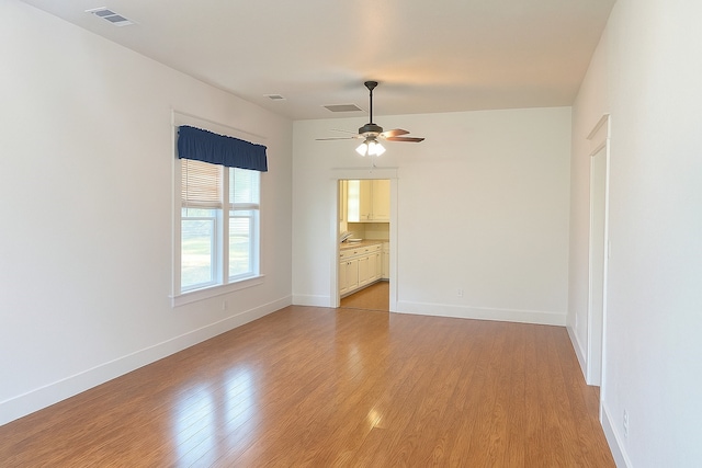 432 S 1st St, Hewitt, TX 76643 - unfurnished room with light wood finished floors and ceiling fan