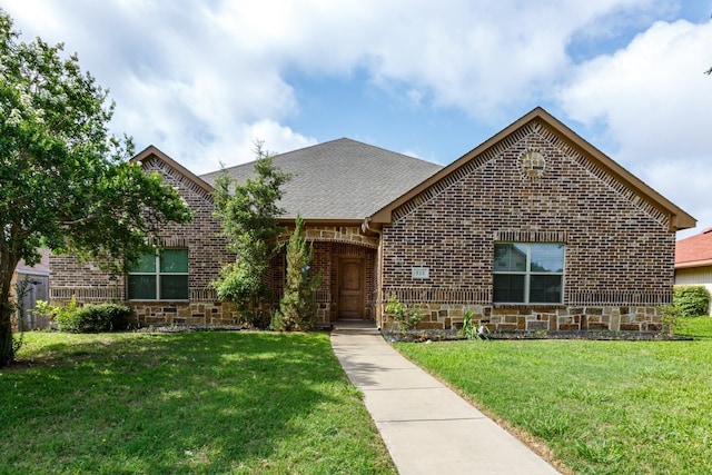 924 Via Barcelona, Mesquite, TX 75150 - view of front of property with brick siding, a front lawn, and roof with shingles