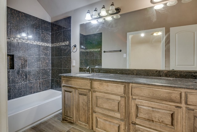 924 Via Barcelona, Mesquite, TX 75150 - full bath featuring double vanity, wood finished floors, shower / bath combination, and vaulted ceiling