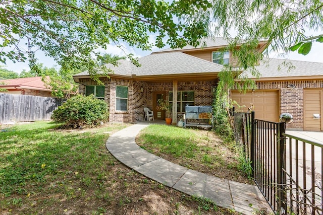924 Via Barcelona, Mesquite, TX 75150 - rear view of house with brick siding, an attached garage, and roof with shingles