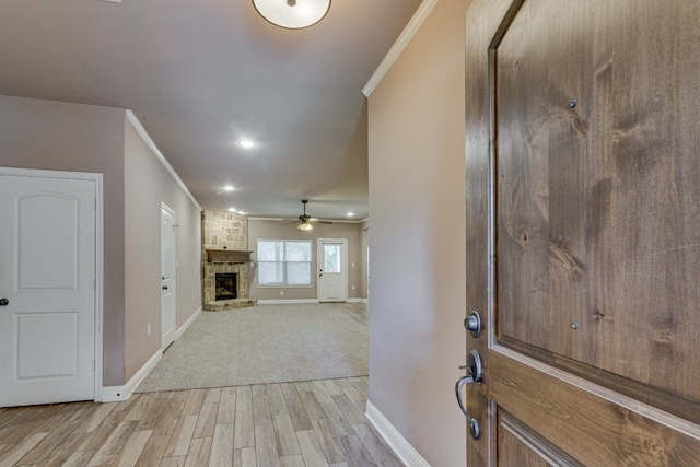 924 Via Barcelona, Mesquite, TX 75150 - entrance foyer featuring ornamental molding, light wood-style flooring, a stone fireplace, ceiling fan, and recessed lighting