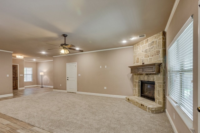 924 Via Barcelona, Mesquite, TX 75150 - unfurnished living room with crown molding, a fireplace, ceiling fan, recessed lighting, and light carpet