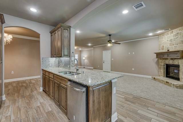 924 Via Barcelona, Mesquite, TX 75150 - kitchen featuring dishwasher, open floor plan, arched walkways, ceiling fan, and light wood finished floors
