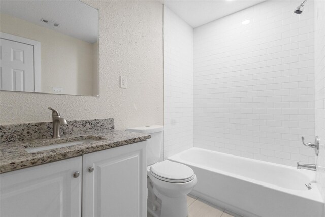 431 W Texas St, Denison, TX 75020 - full bath with vanity, a textured wall, and washtub / shower combination