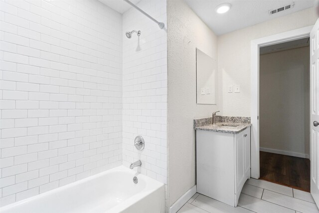 431 W Texas St, Denison, TX 75020 - full bathroom featuring vanity, bathtub / shower combination, and tile patterned floors