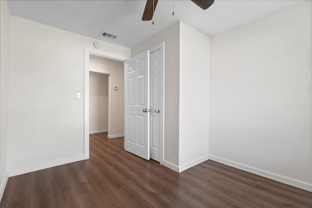 431 W Texas St, Denison, TX 75020 - unfurnished bedroom with dark wood finished floors, ceiling fan, and a closet
