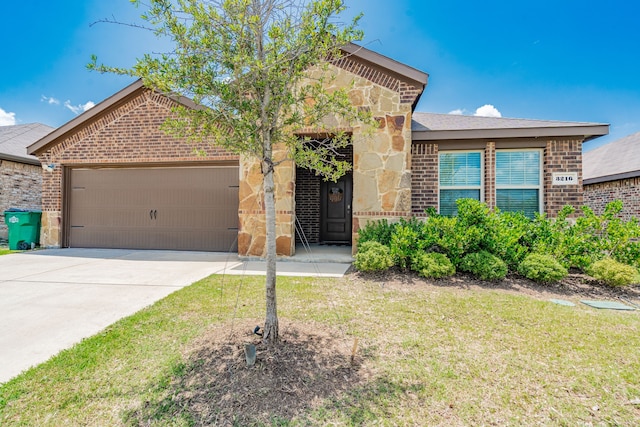 3216 Everly Dr, Fate, TX 75189 - single story home with a garage, brick siding, driveway, a front lawn, and stone siding