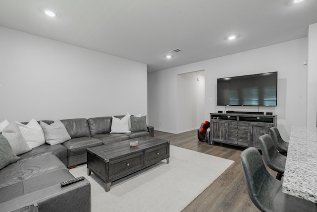3216 Everly Dr, Fate, TX 75189 - living area featuring dark wood-style flooring and recessed lighting