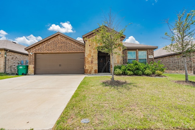 3216 Everly Dr, Fate, TX 75189 - view of front of property with an attached garage, brick siding, a front yard, and concrete driveway