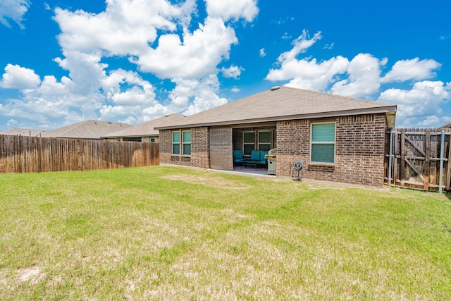 3216 Everly Dr, Fate, TX 75189 - back of house with brick siding, a fenced backyard, and a patio