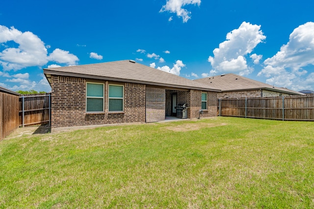 3216 Everly Dr, Fate, TX 75189 - rear view of house featuring brick siding, a fenced backyard, and a shingled roof