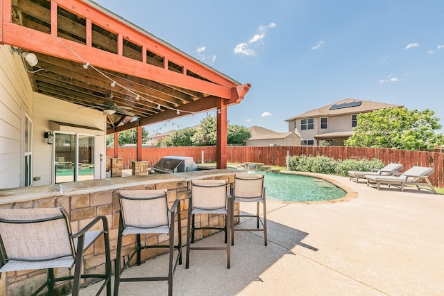 2153 Valley Forge Trl, Fort Worth, TX 76177 - fenced backyard with a bar, area for grilling, and a patio