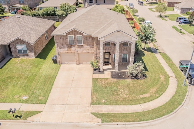 2153 Valley Forge Trl, Fort Worth, TX 76177 - view of front of home featuring driveway, brick siding, a garage, a residential view, and a front lawn