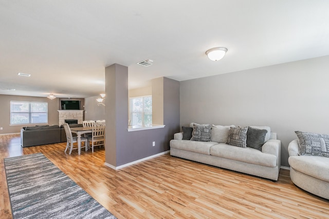 2153 Valley Forge Trl, Fort Worth, TX 76177 - living room featuring wood finished floors and a stone fireplace