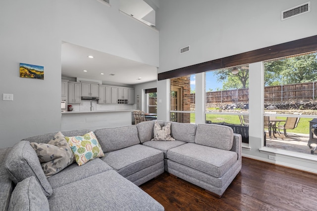 3912 Appleton Ln, Flower Mound, TX 75022 - living area featuring plenty of natural light, dark wood-style floors, recessed lighting, and a towering ceiling