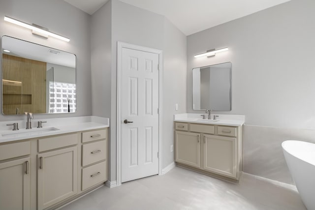 3912 Appleton Ln, Flower Mound, TX 75022 - bathroom with two vanities and a freestanding bath