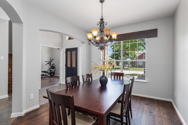 3912 Appleton Ln, Flower Mound, TX 75022 - dining room featuring arched walkways, a chandelier, and wood finished floors