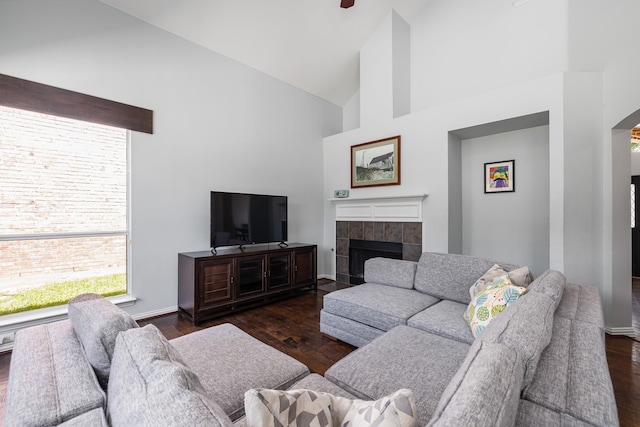 3912 Appleton Ln, Flower Mound, TX 75022 - living area with high vaulted ceiling, dark wood-type flooring, and a tiled fireplace