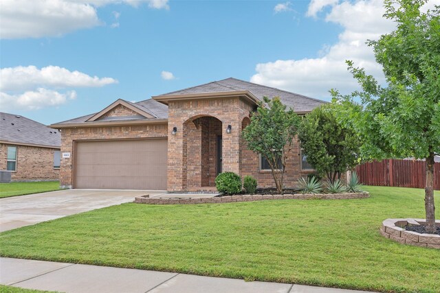 1083 Admiral Dr, Azle, TX 76020 - view of front of house featuring brick siding, an attached garage, driveway, and roof with shingles