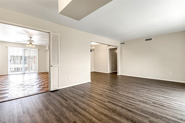 5835 E University Blvd Unit D, Dallas, TX 75206 - unfurnished room with dark wood-style flooring, ceiling fan, and a chandelier