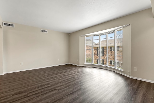 5835 E University Blvd Unit D, Dallas, TX 75206 - spare room featuring dark wood finished floors and baseboards