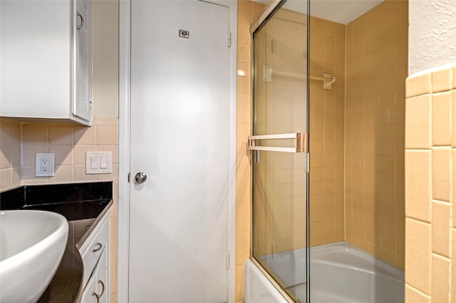 5835 E University Blvd Unit D, Dallas, TX 75206 - full bathroom featuring combined bath / shower with glass door and a sink