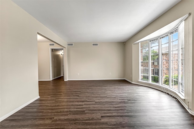 5835 E University Blvd Unit D, Dallas, TX 75206 - spare room featuring dark wood finished floors and baseboards