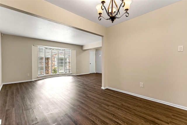 5835 E University Blvd Unit D, Dallas, TX 75206 - spare room with dark wood-style flooring and a chandelier