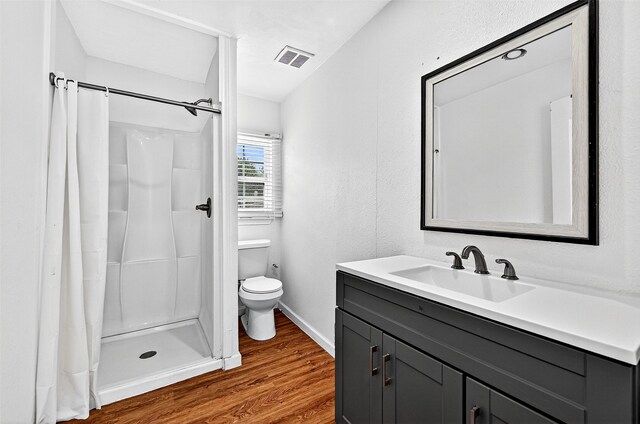 231 Juniper Dr, Pottsboro, TX 75076 - full bathroom featuring wood finished floors, vanity, and a stall shower