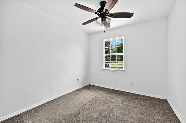231 Juniper Dr, Pottsboro, TX 75076 - spare room with ceiling fan and dark colored carpet