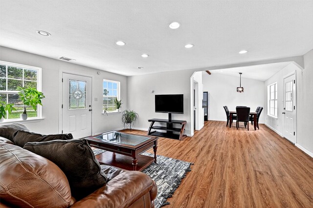 231 Juniper Dr, Pottsboro, TX 75076 - living room with light wood finished floors, recessed lighting, and arched walkways