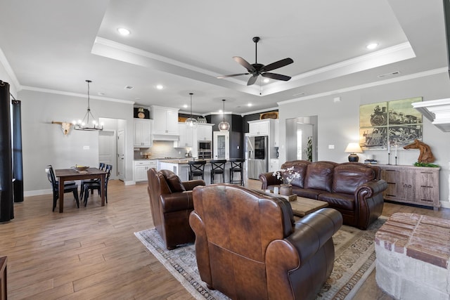 301 Aviara Ct, Poolville, TX 76487 - living room featuring a tray ceiling, ceiling fan, light wood-style floors, recessed lighting, and crown molding