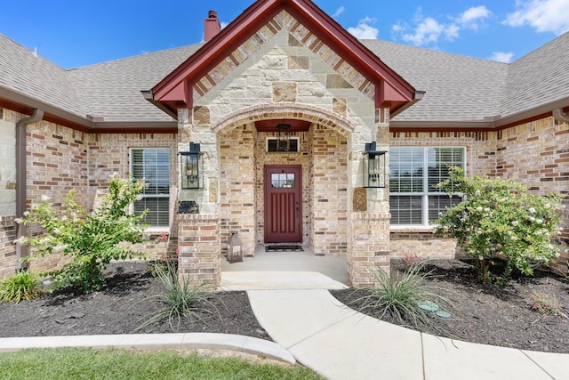 301 Aviara Ct, Poolville, TX 76487 - doorway to property with roof with shingles, brick siding, a chimney, and stone siding