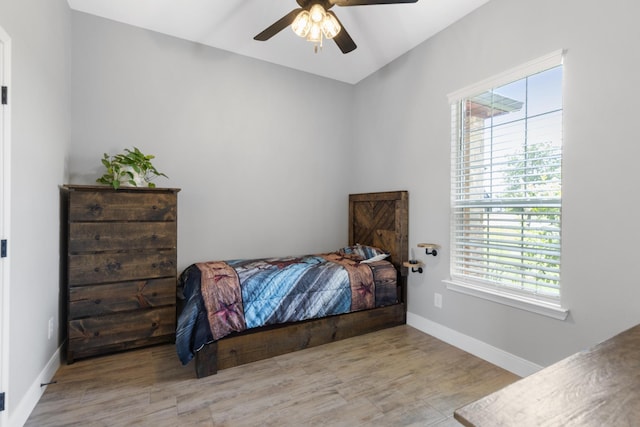 301 Aviara Ct, Poolville, TX 76487 - bedroom featuring multiple windows, wood finished floors, and ceiling fan