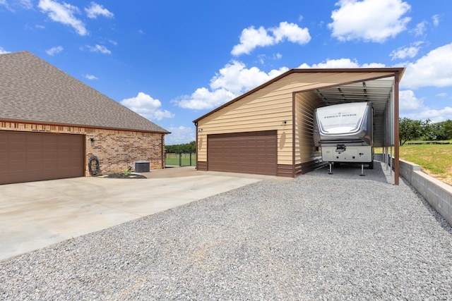 301 Aviara Ct, Poolville, TX 76487 - garage with driveway and a detached garage