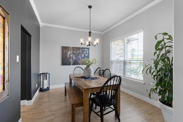 301 Aviara Ct, Poolville, TX 76487 - dining area with ornamental molding, plenty of natural light, light wood-style floors, and a chandelier