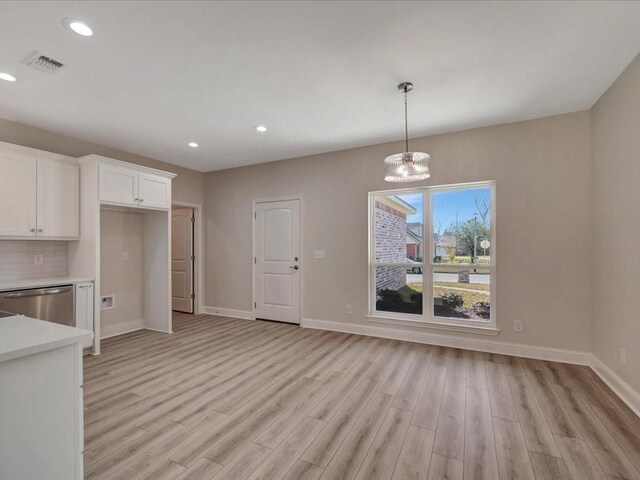108 Saddle Brook Dr, Lufkin, TX 75904 - unfurnished dining area featuring light wood-type flooring, a chandelier, and recessed lighting
