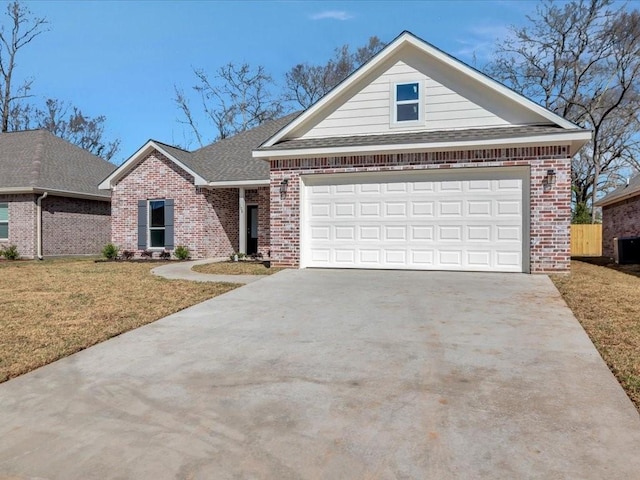 108 Saddle Brook Dr, Lufkin, TX 75904 - view of front of property featuring brick siding, concrete driveway, a front lawn, roof with shingles, and a garage