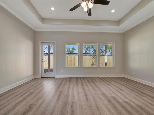 108 Saddle Brook Dr, Lufkin, TX 75904 - unfurnished room featuring a raised ceiling, light wood finished floors, ceiling fan, and recessed lighting