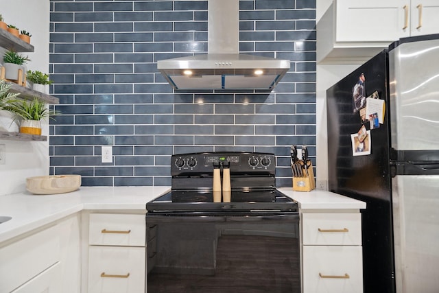 3005 Pate Dr, Fort Worth, TX 76105 - kitchen featuring freestanding refrigerator, black / electric stove, exhaust hood, and tasteful backsplash