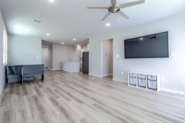 2208 Wexford Way, Forney, TX 75126 - unfurnished living room with ceiling fan, light wood-type flooring, and recessed lighting