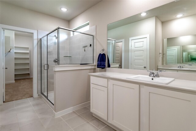 2208 Wexford Way, Forney, TX 75126 - full bath with a stall shower, vanity, tile patterned flooring, a walk in closet, and recessed lighting
