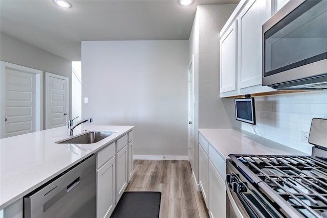 2208 Wexford Way, Forney, TX 75126 - kitchen with appliances with stainless steel finishes, light countertops, white cabinets, and recessed lighting