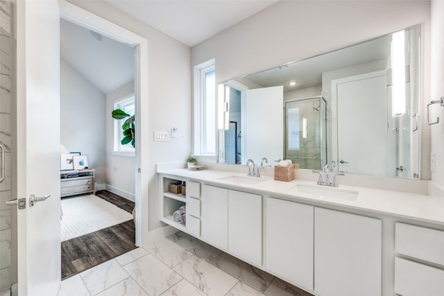 1022 Barsotti Ct, Dallas, TX 75212 - bathroom featuring a stall shower, double vanity, and marble finish floors
