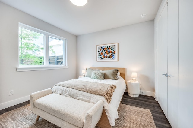 1022 Barsotti Ct, Dallas, TX 75212 - bedroom featuring baseboards and dark wood-type flooring