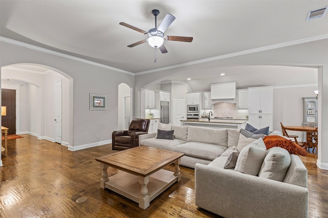 301 Prairie Oak Ct, Burleson, TX 76028 - living area with a ceiling fan, arched walkways, dark wood finished floors, ornamental molding, and recessed lighting