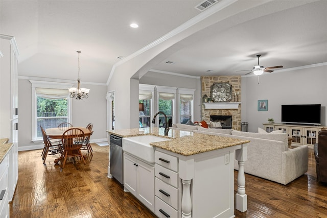 301 Prairie Oak Ct, Burleson, TX 76028 - kitchen featuring a stone fireplace, dishwasher, a ceiling fan, white cabinetry, and dark wood-type flooring