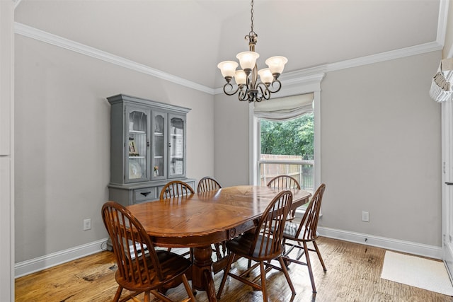 301 Prairie Oak Ct, Burleson, TX 76028 - dining space featuring a chandelier, ornamental molding, light wood finished floors, and vaulted ceiling